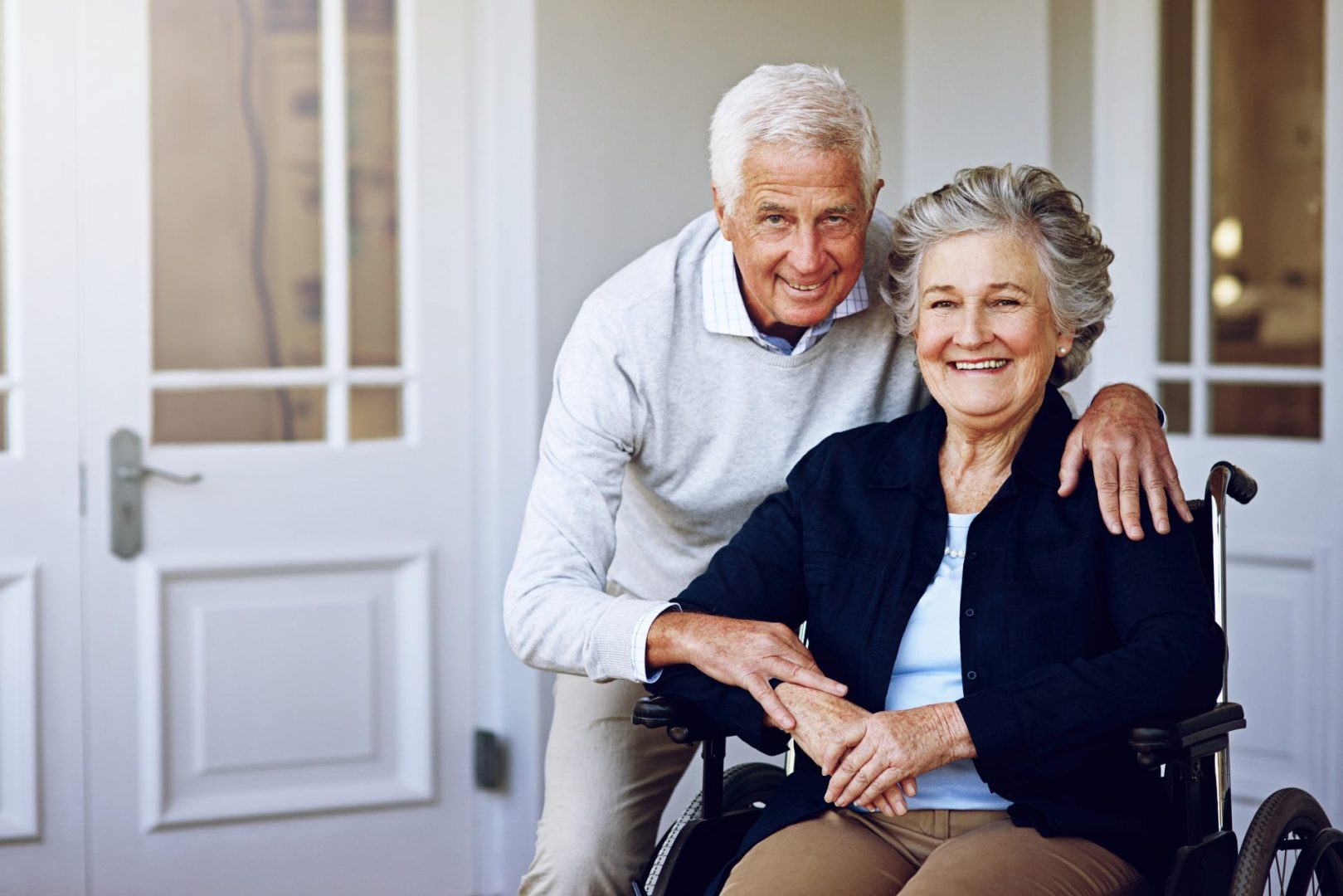 man and woman hugging and smiling