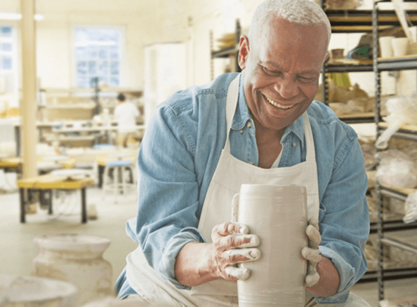 man using pottery wheel