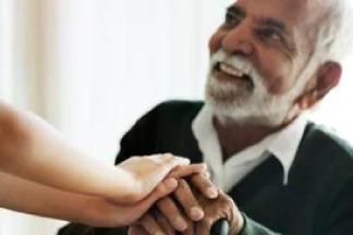 senior man holding his grandson's hand