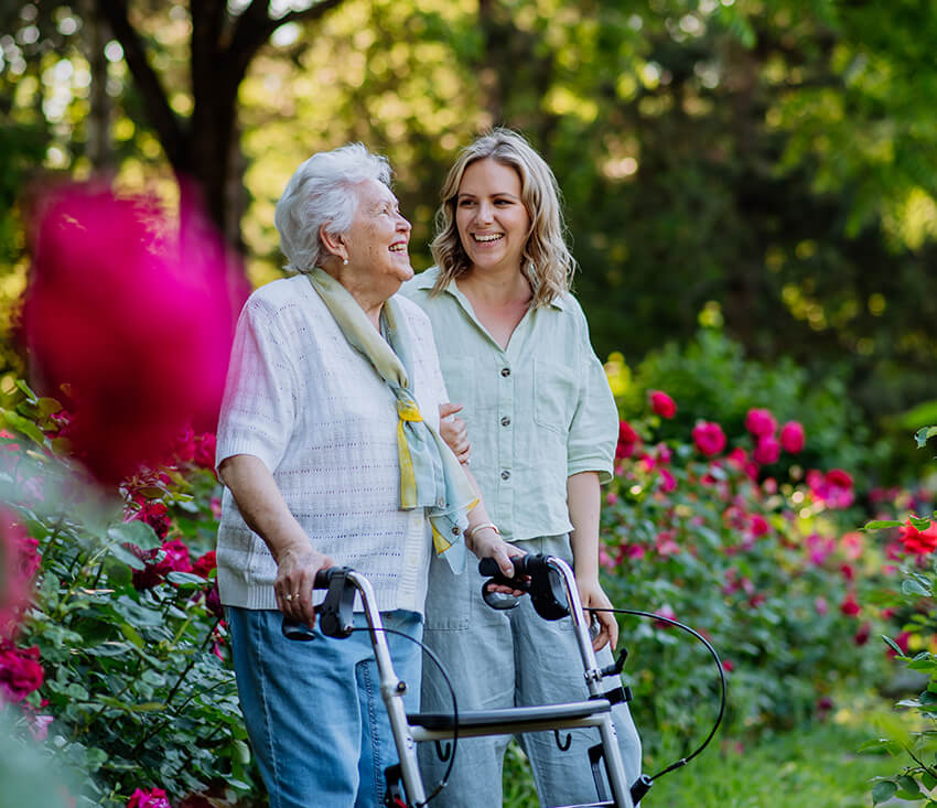 Senior woman walking with adult daughter